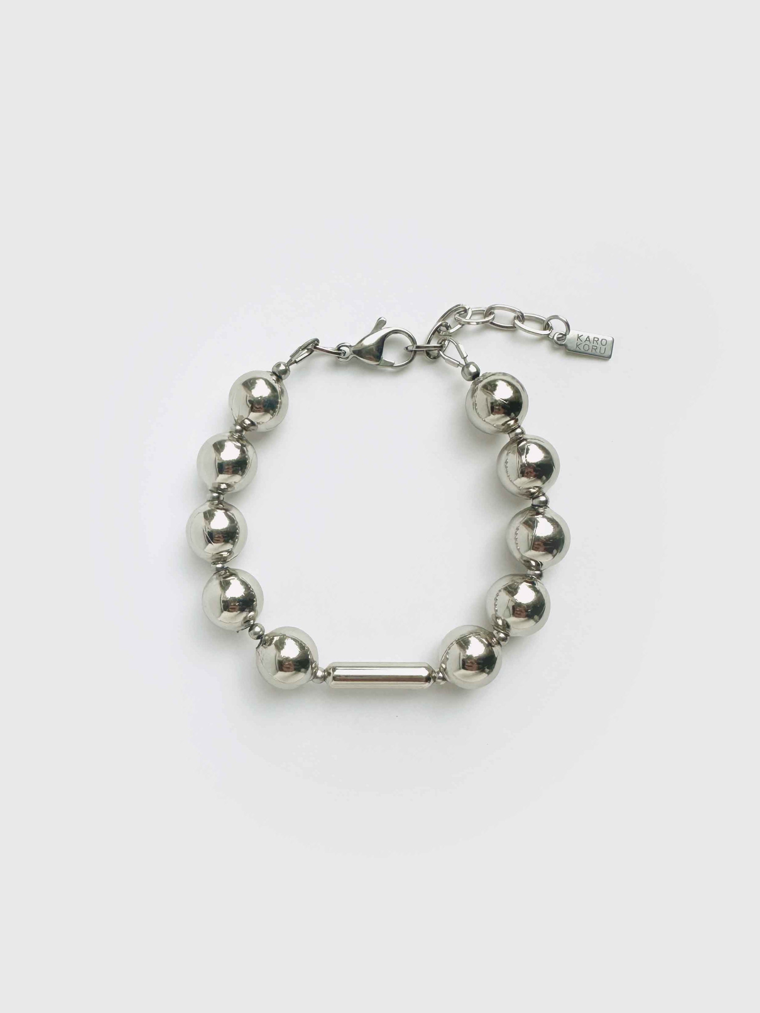 Silver beaded bracelet on a white background