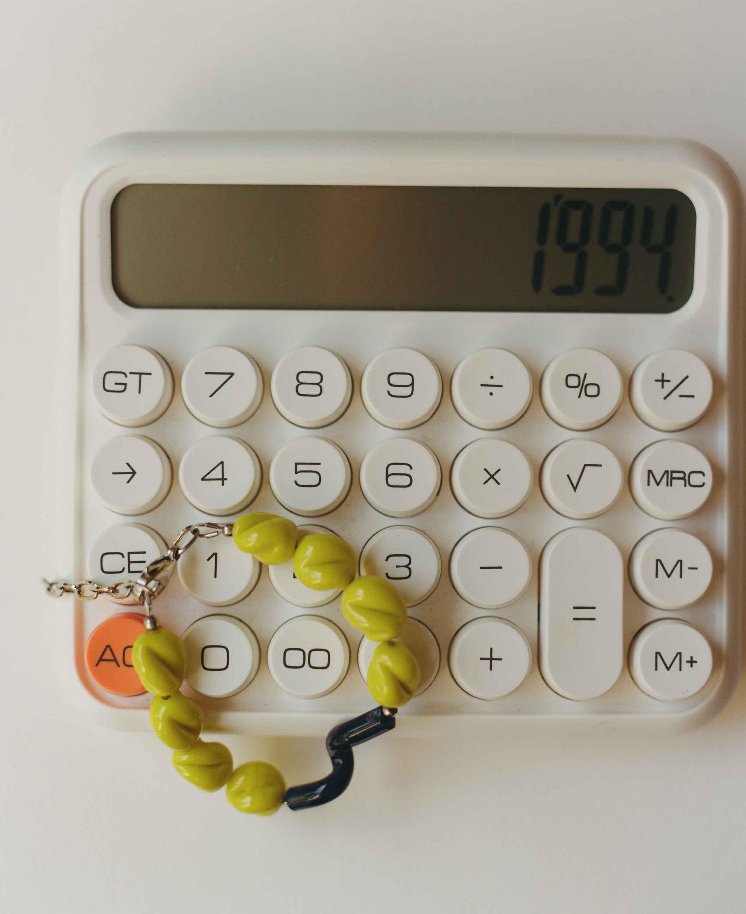 Calculator with a bracelet on top displaying the year 1994