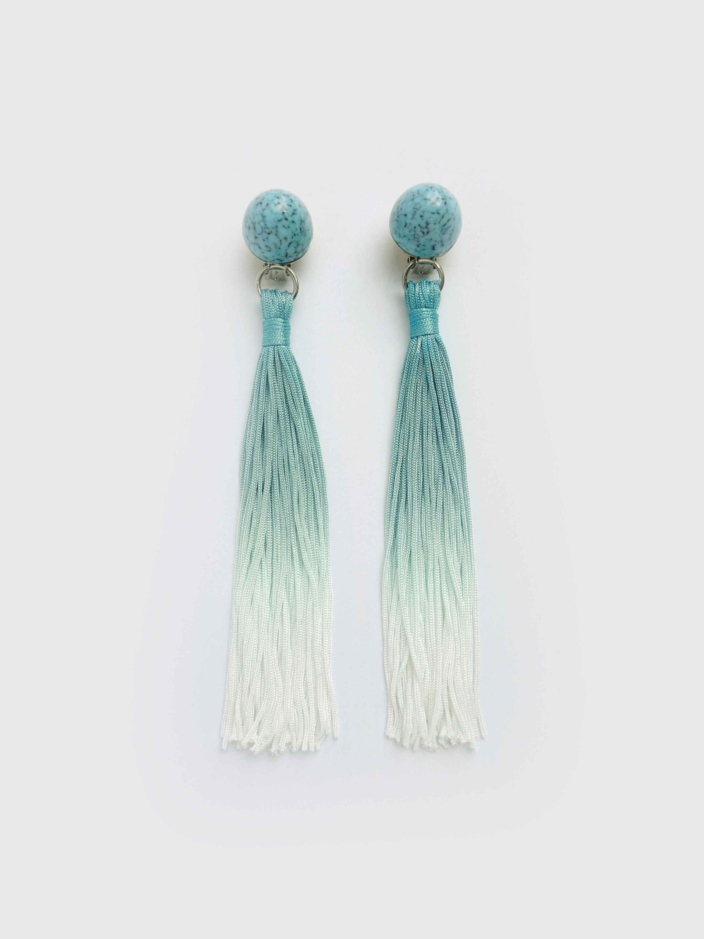 Pair of earrings with gradient tassels on a white background